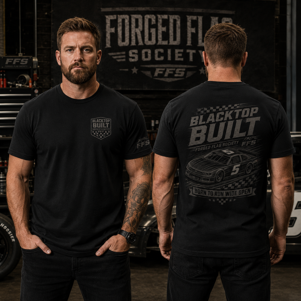 Two men wearing black t-shirts with 'Forged Flag Society' branding in a garage setting.
